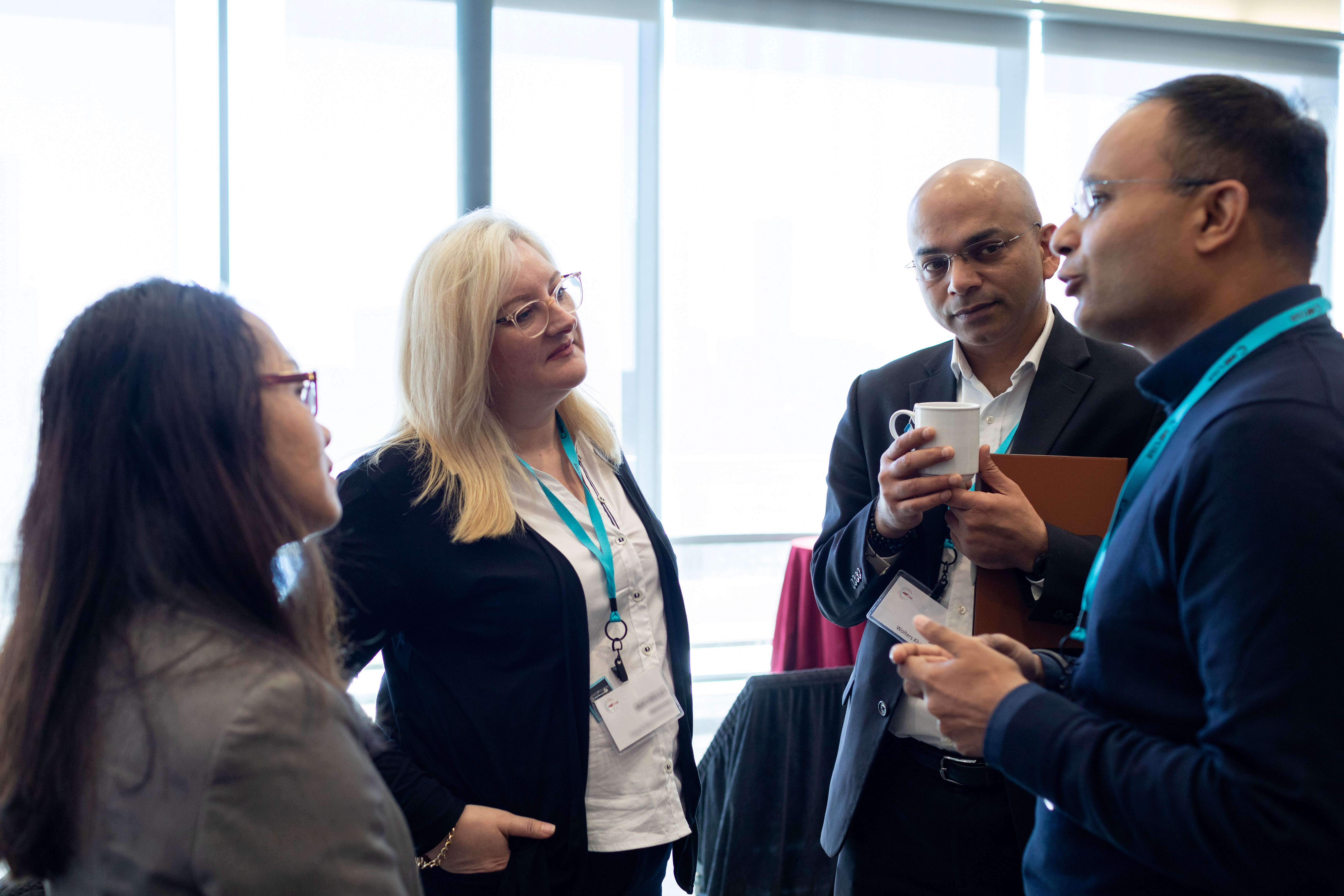 Attendees speaking with each other
