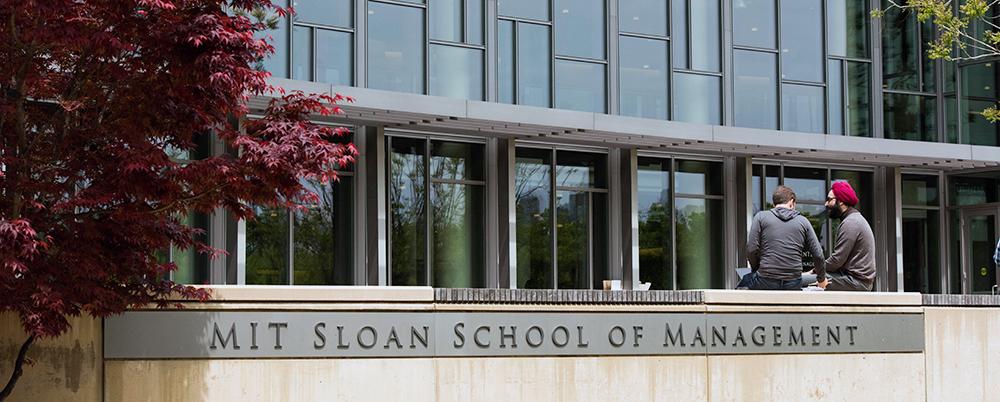 MIT Sloan building rear with students
